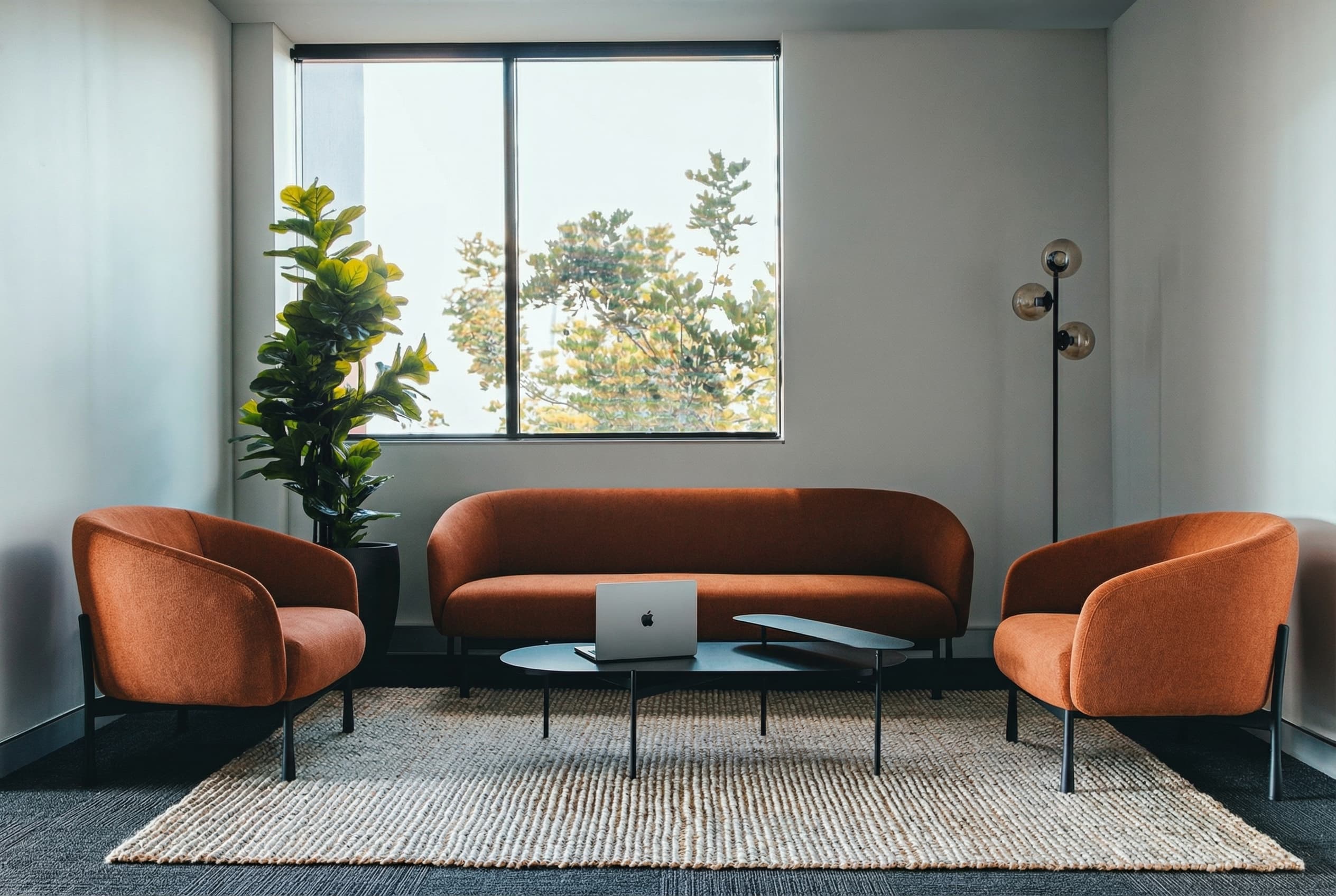 seating area with a sofa and lounge chairs
