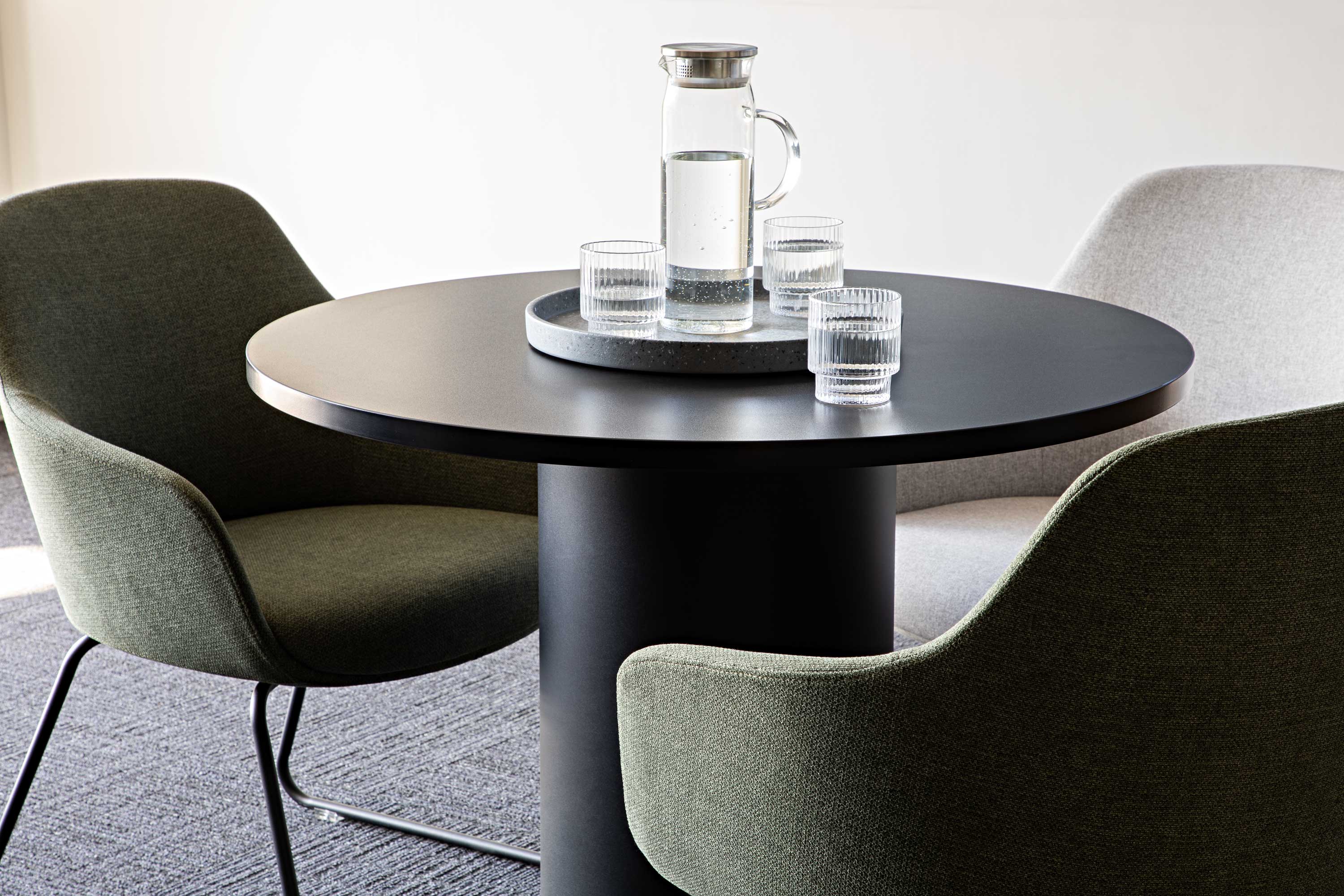 Side-by-side comparison of a standard office chair and a modern ergonomic chair